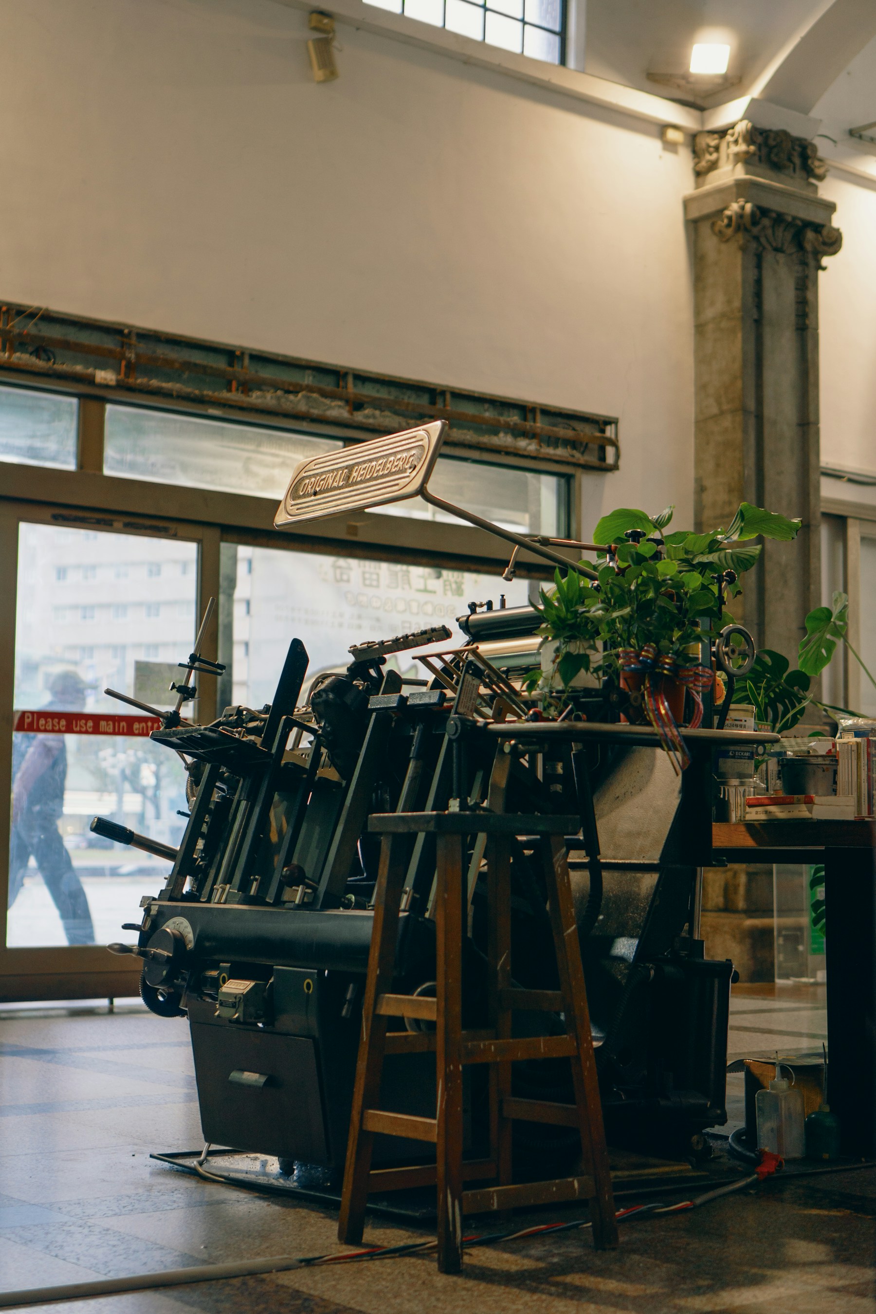 Letterpress printing press in a quiet workshop, the mood of our Robinson Road press room.